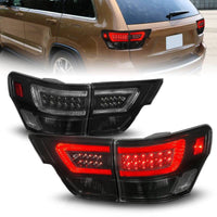 ANZO 11-13 Jeep Grand Cherokee LED Taillights w/ Lightbar Black Housing/Smoke Lens 4pcs - My Store